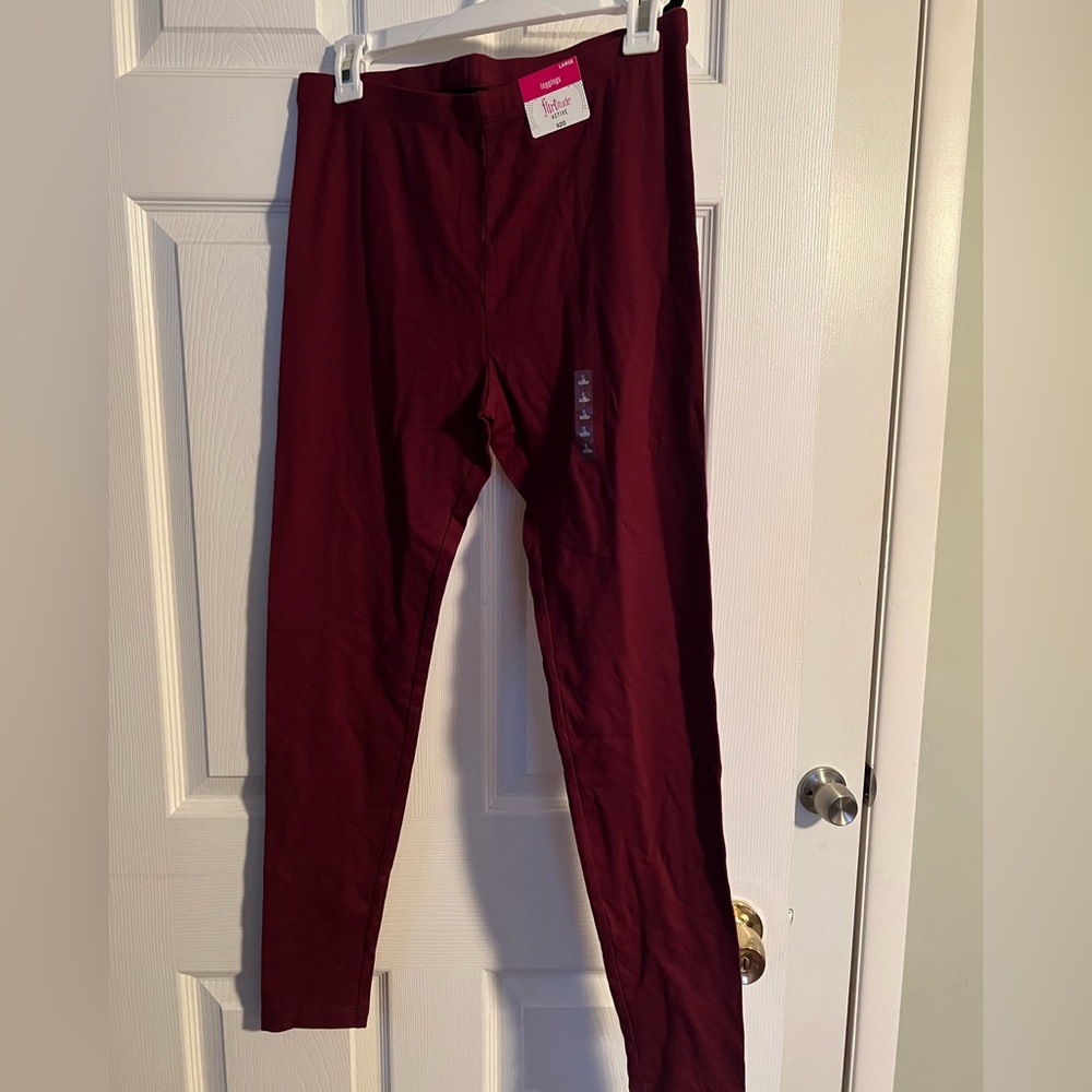 Burgundy brand new Flirtitude leggings. Size Large
